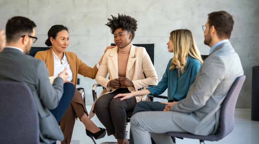 Image of men and women attending an Employee Assistance Program session for workplace alcohol and mental health support