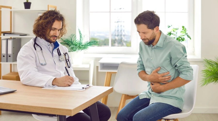 Image of Doctor consulting patient about gastrointestinal bleeding and alcohol-related stomach issues