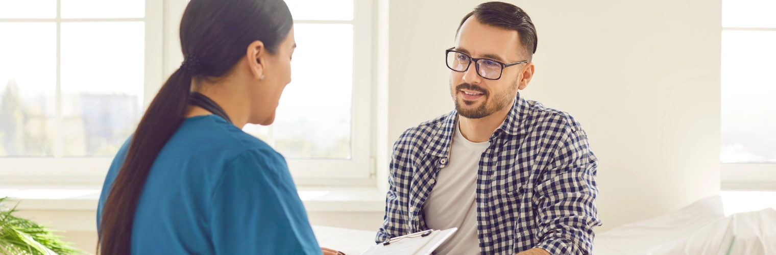 Image of patient reviewing rehab insurance coverage options with a coordinator