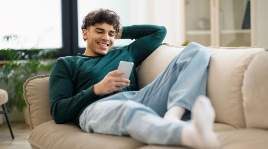 Patient using a Mobile phone in a rehab center to stay connected with loved one