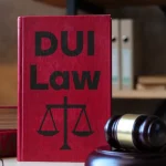 Image of a DUI Law Book beisde a gavel on a desk - Can I Go to Rehab Instead of Jail for DUI Charges in Georgia or Nationwide - Ingrained Recoveryy