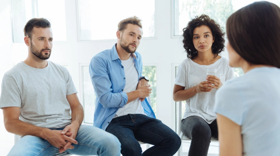 Family encouraging a person to accept inpatient rehab for substance use and mental health support