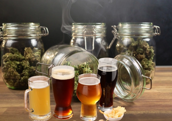 Image of glasses of alcoholic beverages and weed in clear glass cannisters - Combining Weed And Alcohol Together