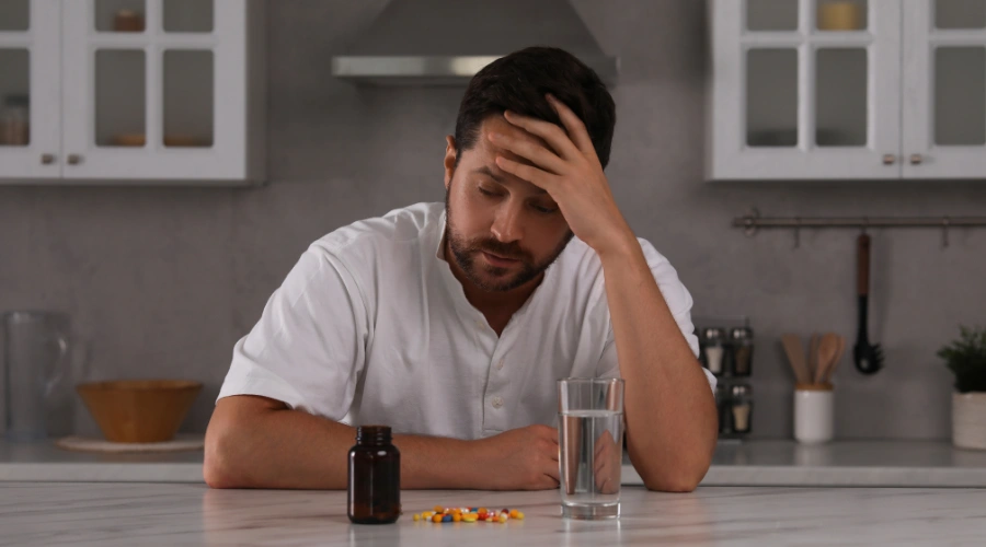 Image of a man experiencing physical health effects linked to substance abuse