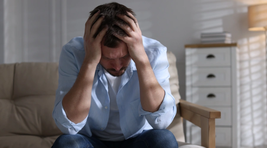 Image of a man high-functioning professional feeling anxious about seeking addiction treatment