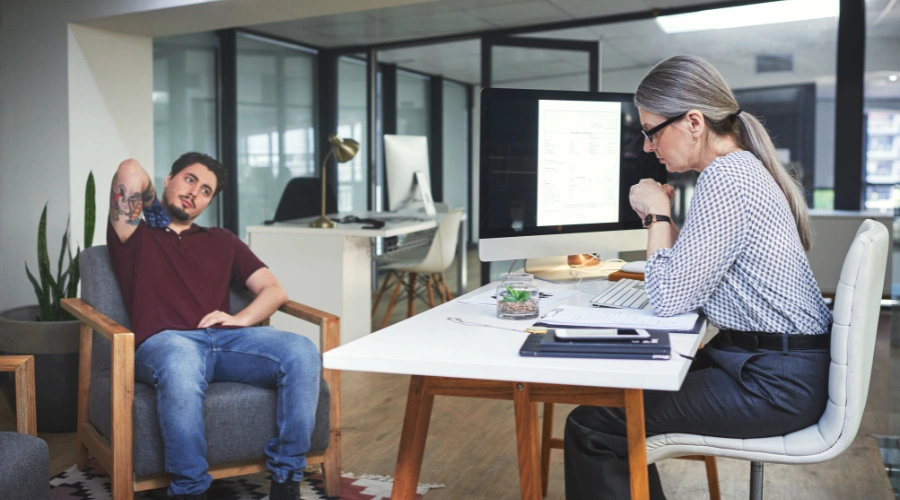 Image of a man talking to a counselor in therapy, while attending a court-ordered addiction treatment program as an alternative to jail