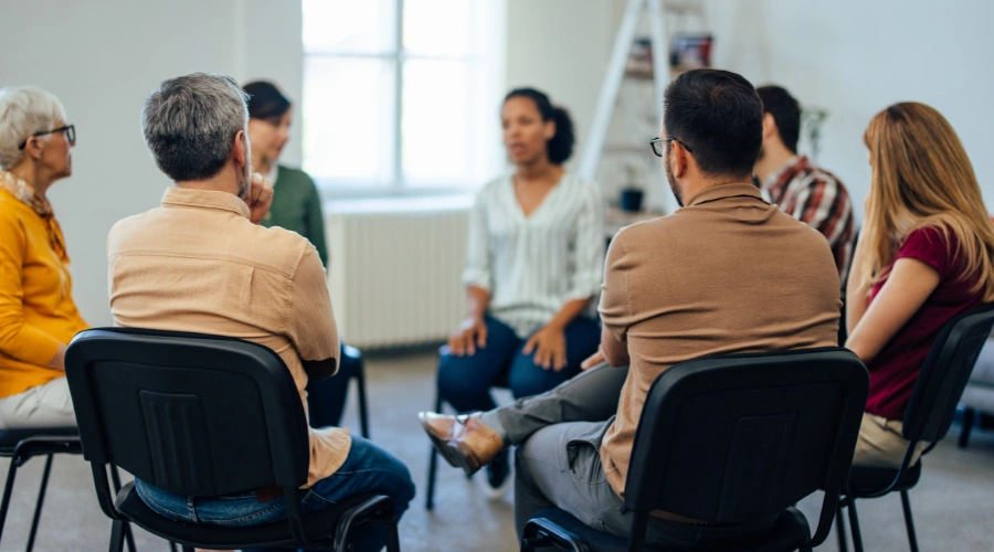 Image of a group therapy session at a rehab