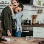 Image of a wife hugging and consoling her husband - Is My Loved One a Functioning Drug Addict - Ingrained Recovery