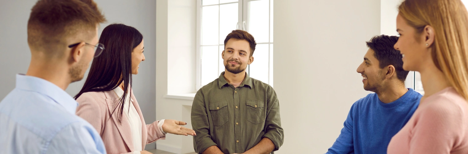 Rehab Alumni Programs at Ingrained Recovery Image of men and women in a circle at a support group meeting - Rehab Alumni Programs at Ingrained Recovery