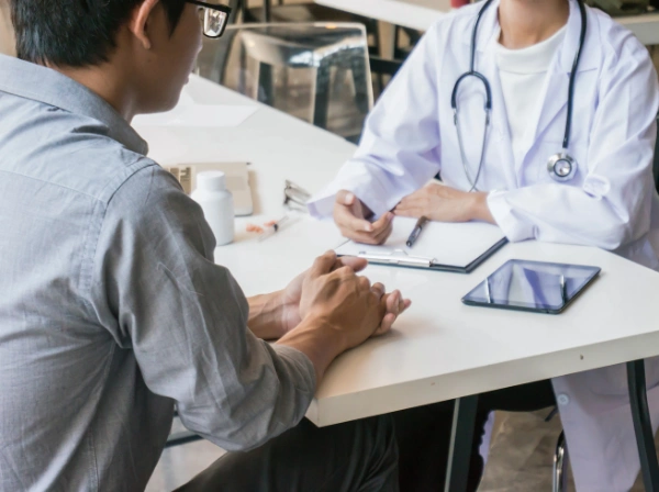 Image of a healthcare professional explaining Alliant behavioral health insurance benefits for mental health treatment Image of a healthcare professional explaining Alliant behavioral health insurance benefits for mental health treatment with a patient