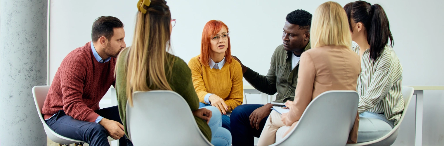 Image of couple participating together in a recovery support meeting focused on communication Image of couple participating together in a Recovering Couples Anonymous support meeting focused on communication