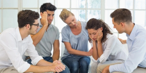 Image of couple in recovering couples anonymous discussing relationship growth during a peer support meeting - Recovering Couples Anonymous - Ingrained Recovery