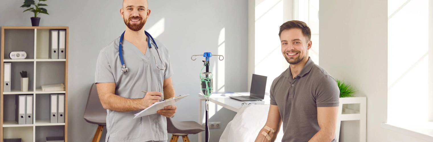 Image of healthcare provider monitoring patient during NAD IV therapy to ensure safety and manage side effects Image of healthcare provider monitoring a content patient during NAD IV therapy to ensure safety and manage side effects