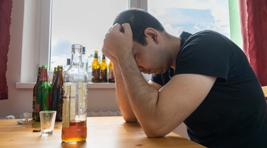 Image of person struggling with negative self-beliefs linked to drug and alcohol addiction recovery
