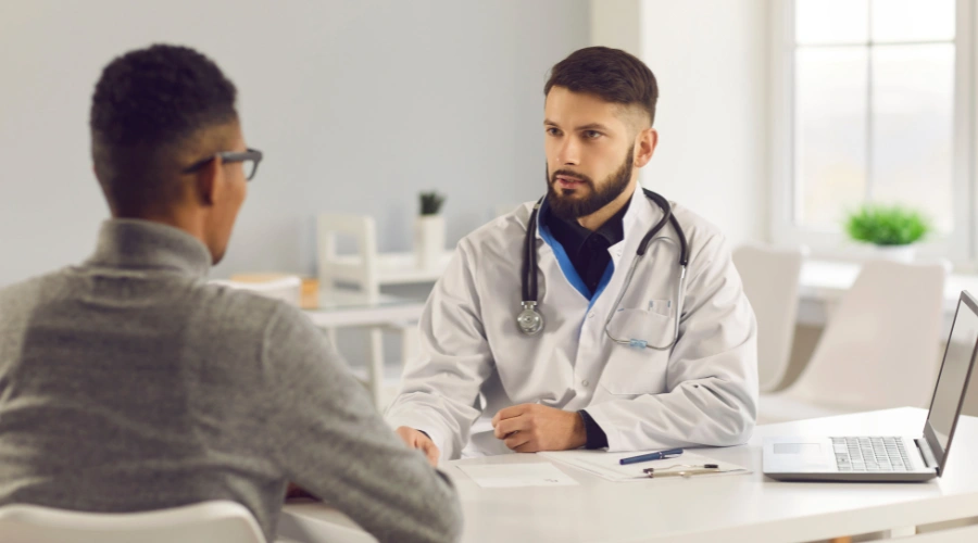 Image of a Healthcare professional consulting with a patient during a medical appointment