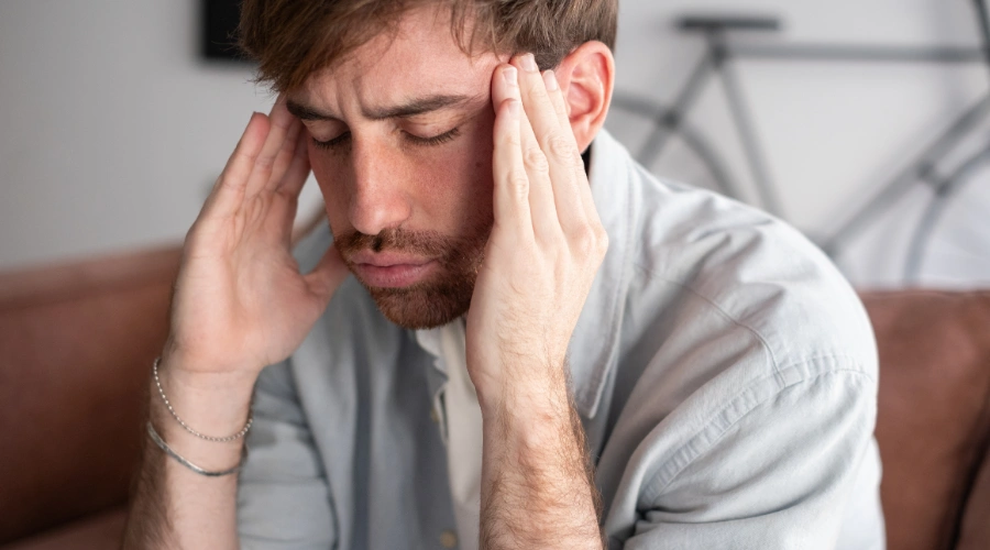 Image of a person in recovery experiencing pain, anxiety, and coping challenges that may lead to kratom use
