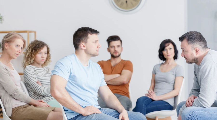Image of a person setting healthy boundaries during a difficult family conversation about substance use treatment