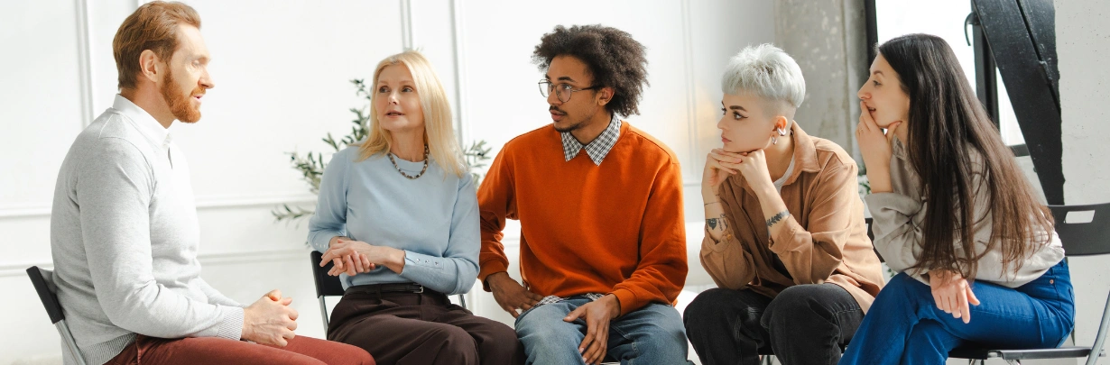 Image of a small group therapy session in a bright counseling room Marijuana Addiction Residential Program in Georgia