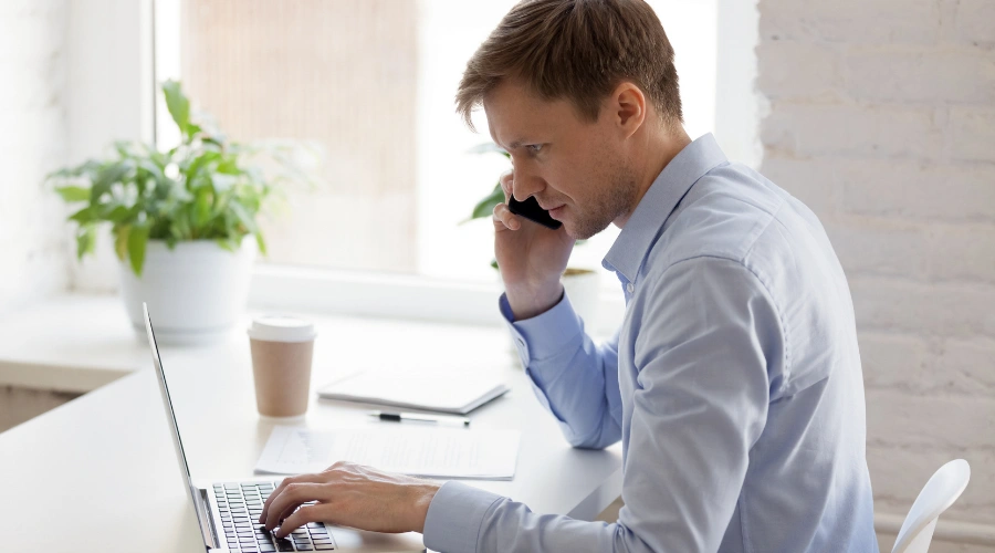 Image of an admissions counselor on the phone providing professional support and guidance to begin recovery