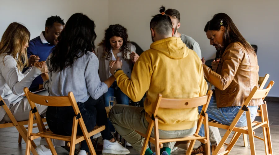 Image of a group practicing grounding skills and sensory techniques through a group