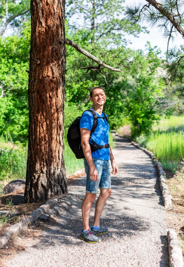 Image of a happy person during a forest walk Image of a happy person during a forest walk