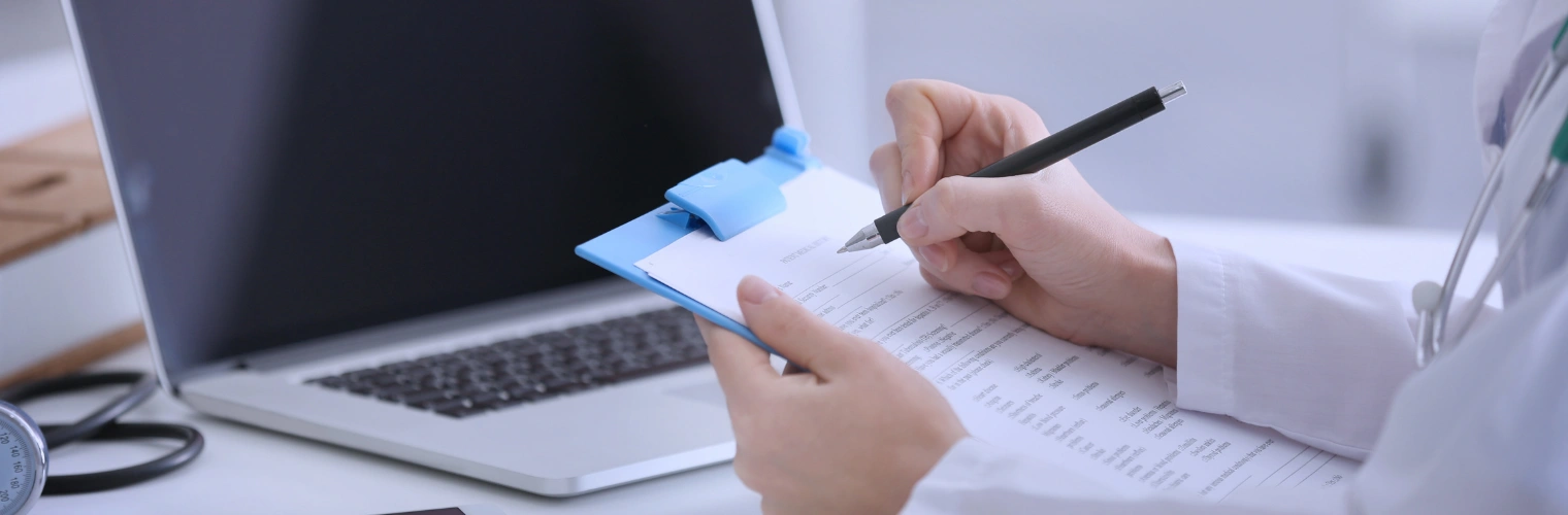 Image of a healthcare counselor reviewing HMO and PPO plan options to explain network benefits Image of a healthcare counselor reviewing HMO and PPO plan options to explain network benefits